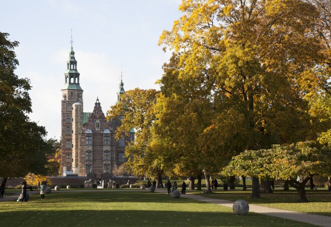 Trees with fall-colored foliage at Rosenborg Castle in Copenhagen, Denmark